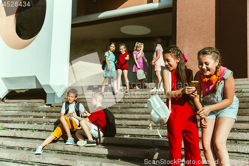 Image of Happy kids playing at city\'s street in sunny summer\'s day