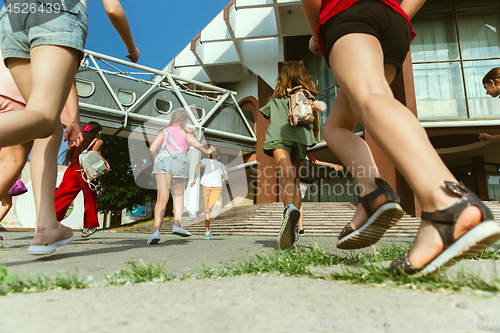 Image of Happy kids playing at city\'s street in sunny summer\'s day