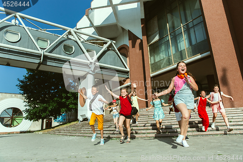 Image of Happy kids playing at city\'s street in sunny summer\'s day