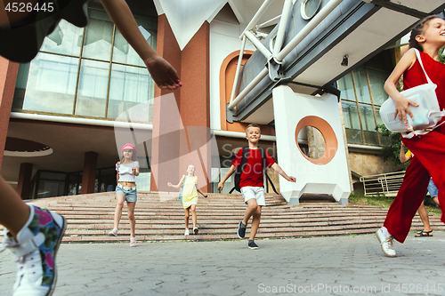 Image of Happy kids playing at city\'s street in sunny summer\'s day