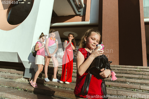 Image of Happy kids playing at city\'s street in sunny summer\'s day