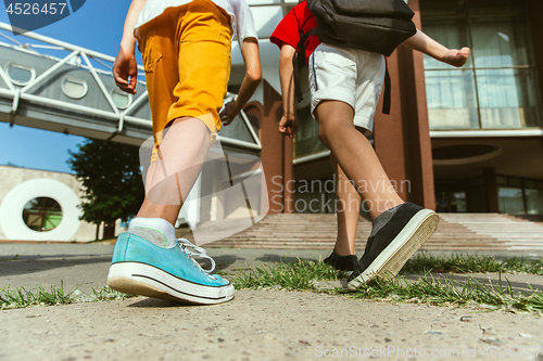 Image of Happy kids playing at city\'s street in sunny summer\'s day