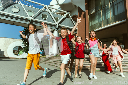 Image of Happy kids playing at city\'s street in sunny summer\'s day