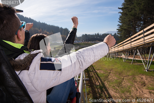 Image of couple enjoys driving on alpine coaster