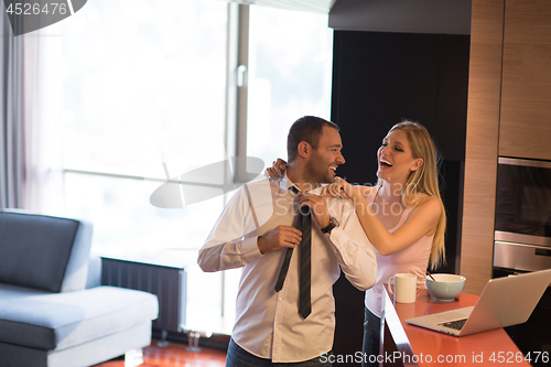 Image of A young couple is preparing for a job and using a laptop