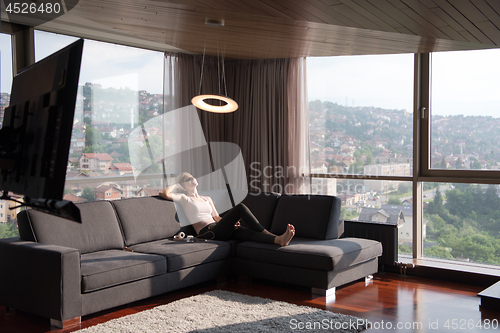 Image of woman using tablet in beautiful apartment