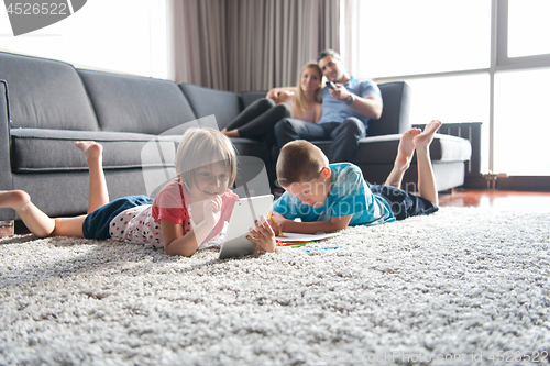 Image of young couple spending time with kids