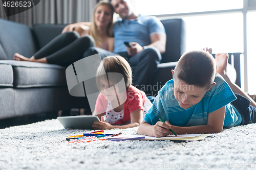 Image of young couple spending time with kids