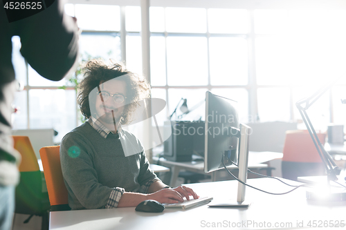 Image of businessman working using a computer in startup office