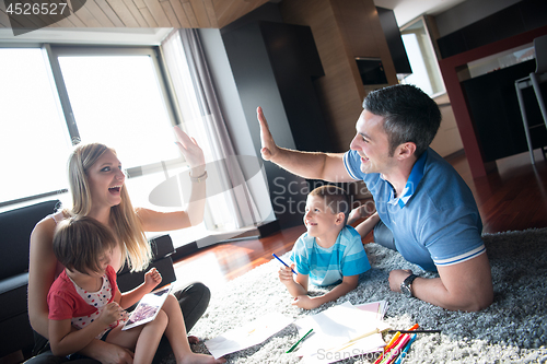 Image of young couple spending time with kids