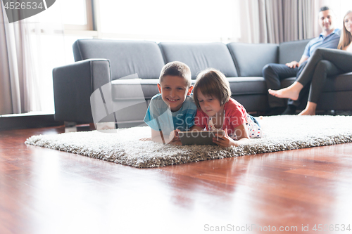 Image of couple spending time with kids