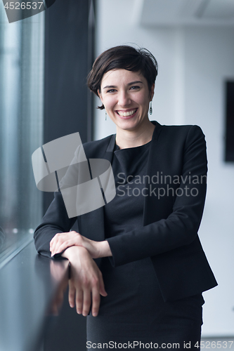 Image of Portrait of successful Businesswoman by the window