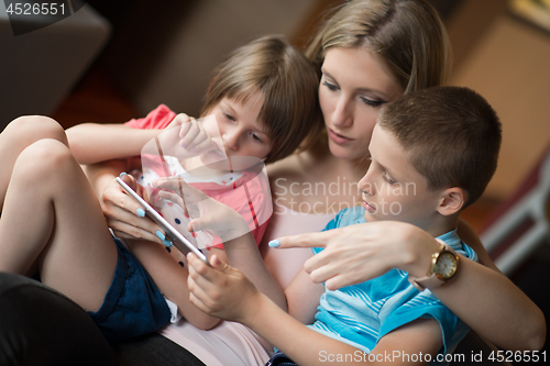 Image of Young Family Using A Tablet To Make Future Plans