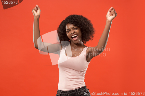 Image of Winning success woman happy ecstatic celebrating being a winner. Dynamic energetic image of female afro model