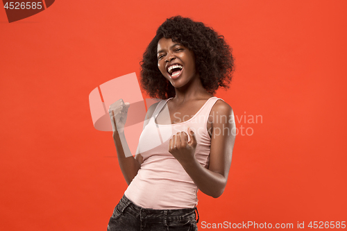 Image of Winning success woman happy ecstatic celebrating being a winner. Dynamic energetic image of female afro model