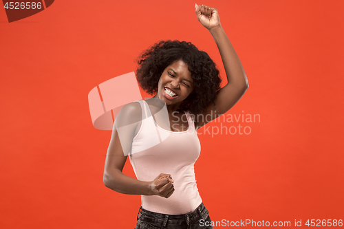 Image of Winning success woman happy ecstatic celebrating being a winner. Dynamic energetic image of female afro model