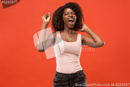 Image of Winning success woman happy ecstatic celebrating being a winner. Dynamic energetic image of female afro model