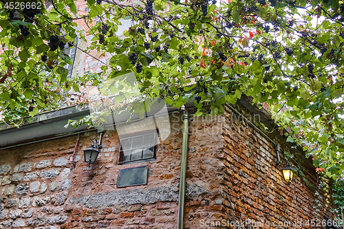 Image of old brick building with lanterns