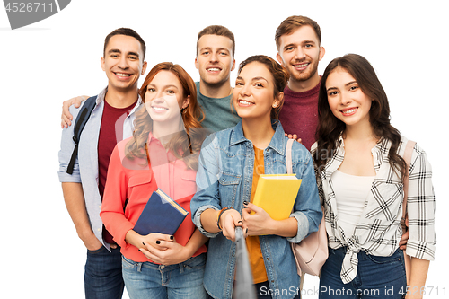 Image of group of smiling students with books taking selfie