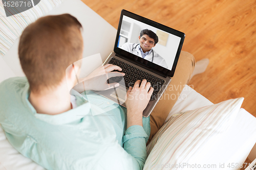 Image of patient having video call with doctor on laptop