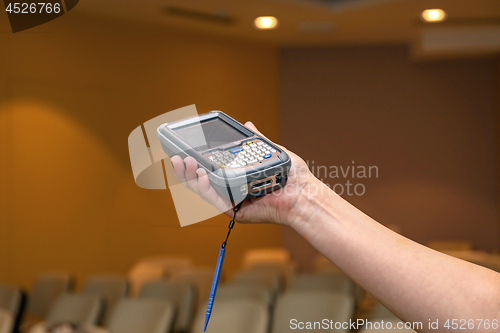 Image of Woman Holding Pda