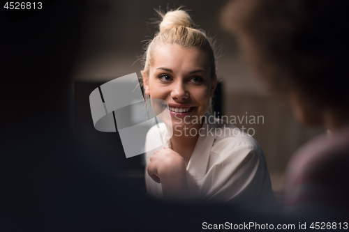 Image of Multiethnic startup business team in night office