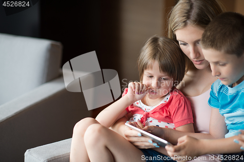 Image of Young Family Using A Tablet To Make Future Plans