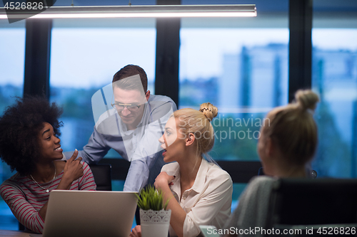 Image of Multiethnic startup business team in night office