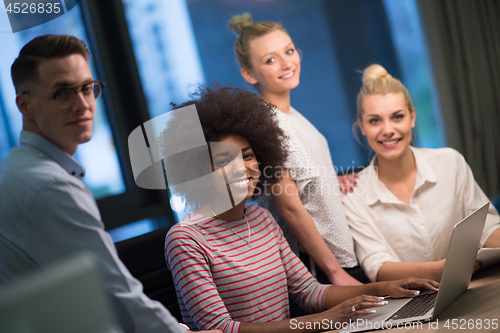 Image of Multiethnic startup business team in night office