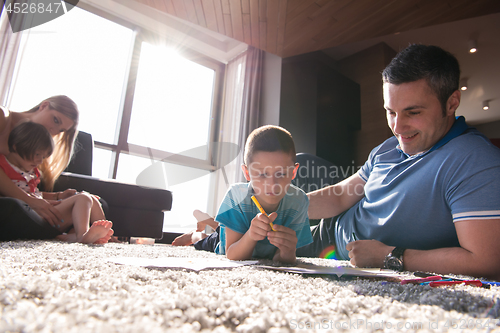 Image of young couple spending time with kids