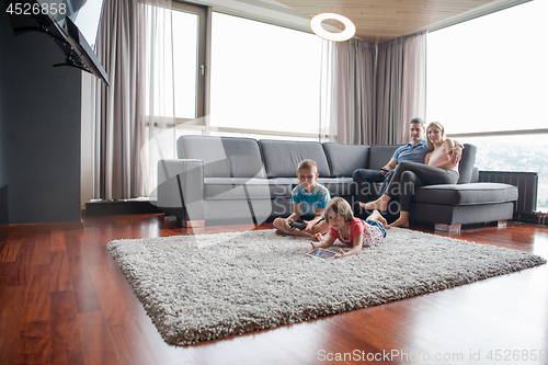 Image of couple spending time with kids