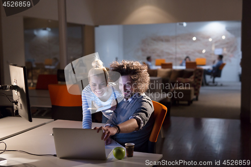 Image of young designers in the night office