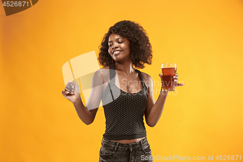 Image of Sexy young afro woman drinking beer, not isolated on white background