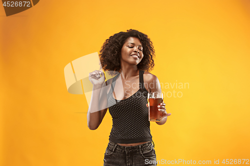 Image of Sexy young afro woman drinking beer, not isolated on white background