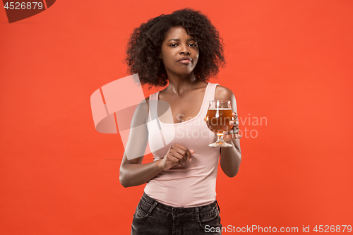 Image of Sexy young afro woman drinking beer, not isolated on white background