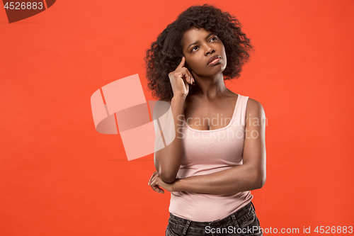 Image of Young serious thoughtful business woman. Doubt concept.