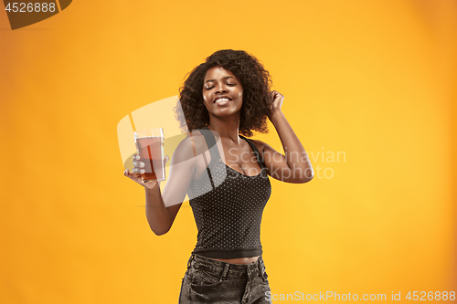 Image of Sexy young afro woman drinking beer, not isolated on white background