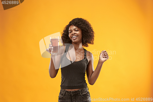 Image of Sexy young afro woman drinking beer, not isolated on white background