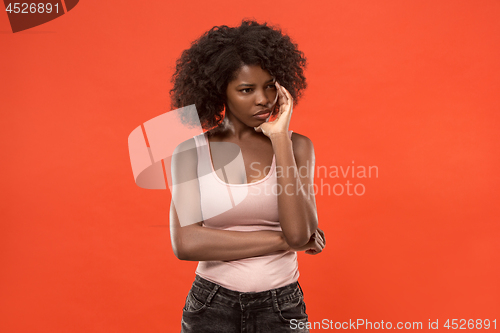 Image of Young serious thoughtful business woman. Doubt concept.