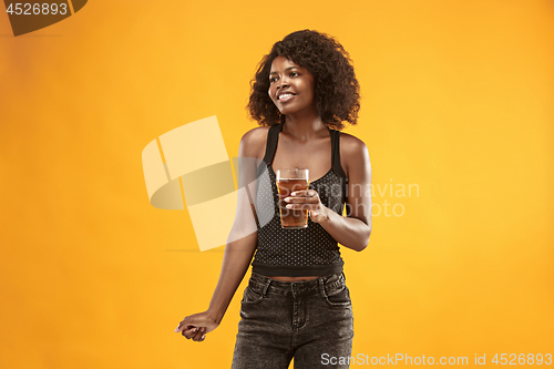 Image of Sexy young afro woman drinking beer, not isolated on white background