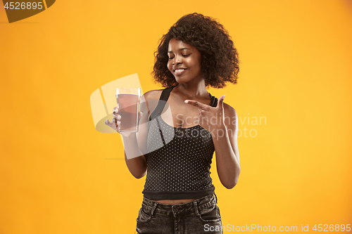 Image of Sexy young afro woman drinking beer, not isolated on white background