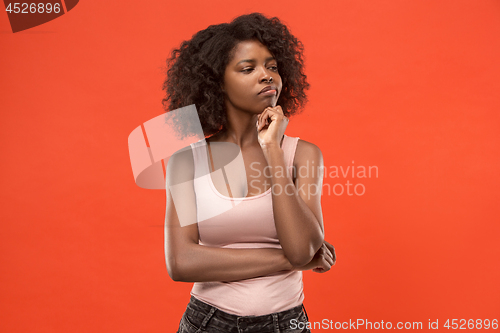 Image of Young serious thoughtful business woman. Doubt concept.