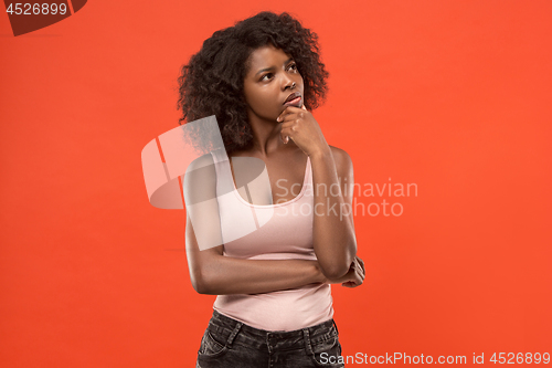 Image of Young serious thoughtful business woman. Doubt concept.