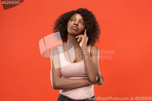 Image of Young serious thoughtful business woman. Doubt concept.