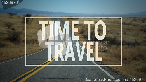 Image of Time to travel word with country road