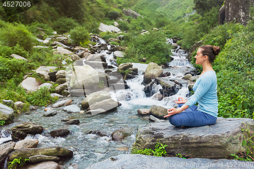 Image of Woman in Padmasana outdoors