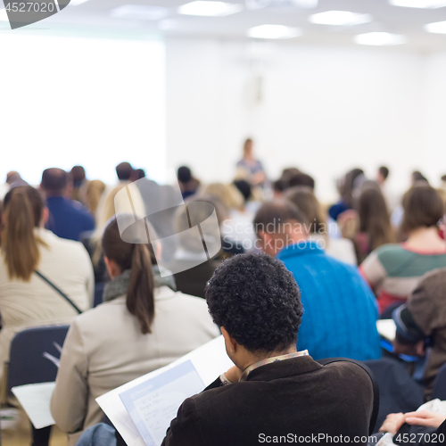 Image of Woman giving presentation on business conference.