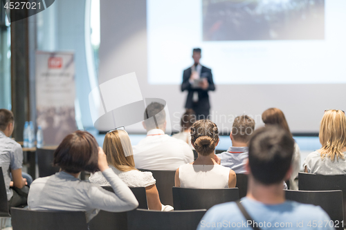 Image of Male business speaker giving a talk at business conference event.