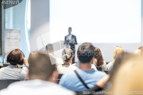 Image of Male business speaker giving a talk at business conference event.