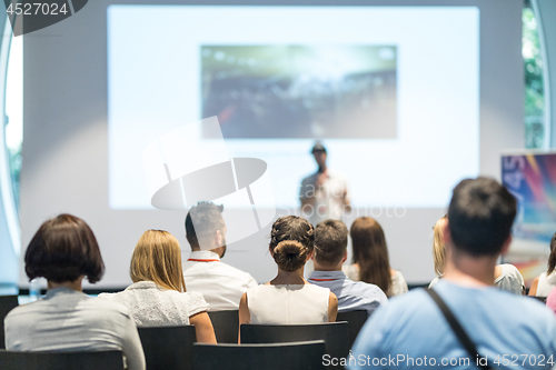 Image of Male business speaker giving a talk at business conference event.